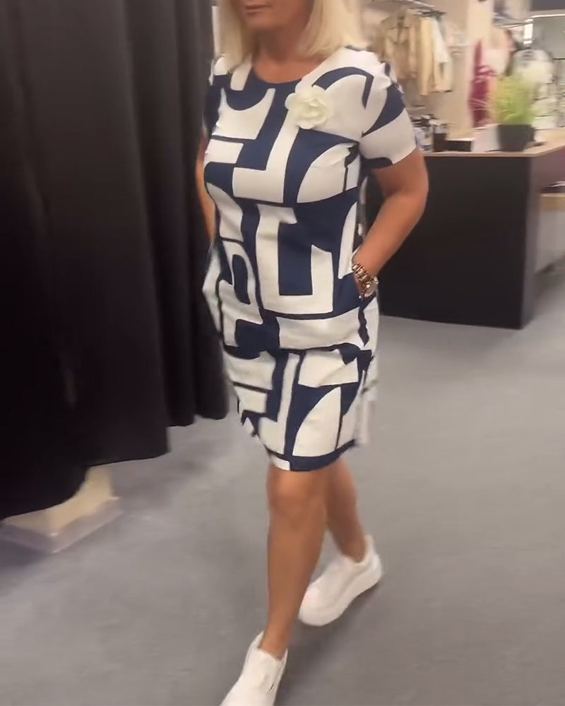 Geometriskt tryck fickklänning med rund hals