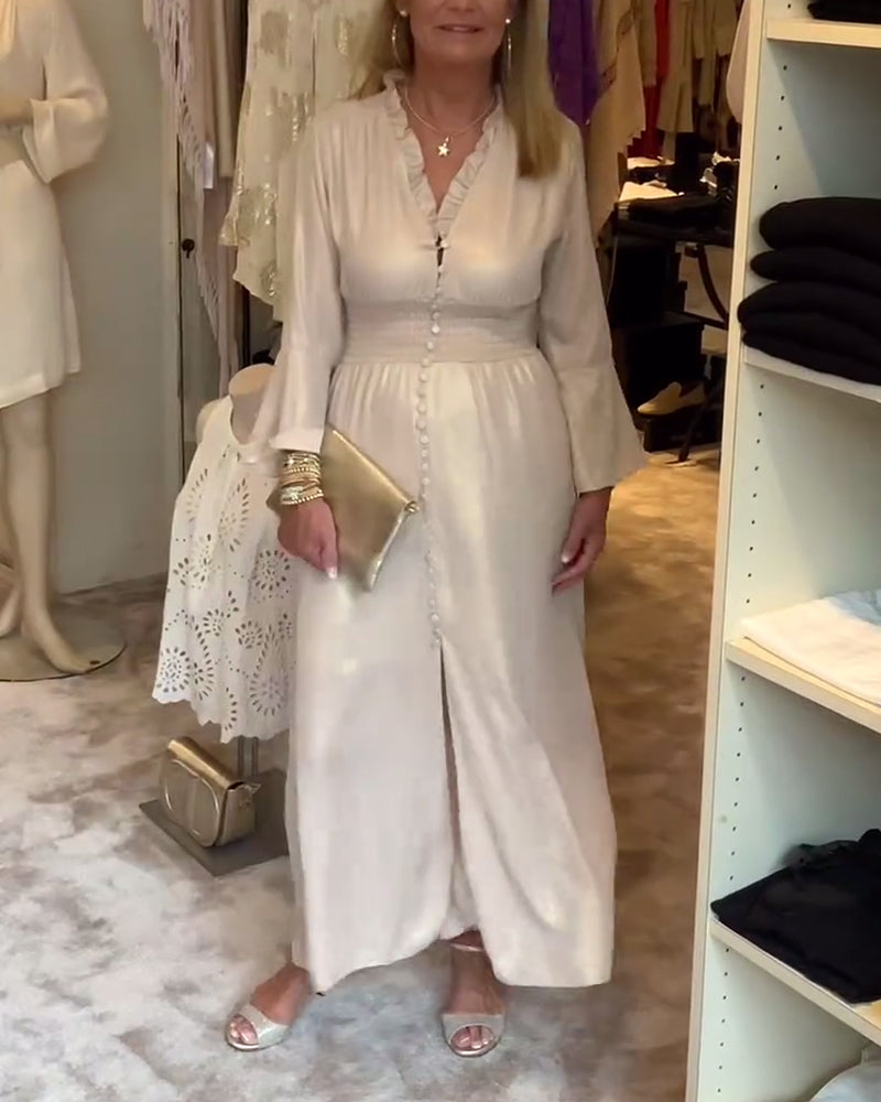 Lång klänning i spetskrage med knäppning i midjan