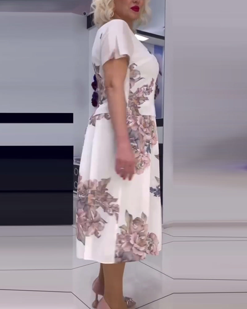 Blommig elegant klänning med rund hals