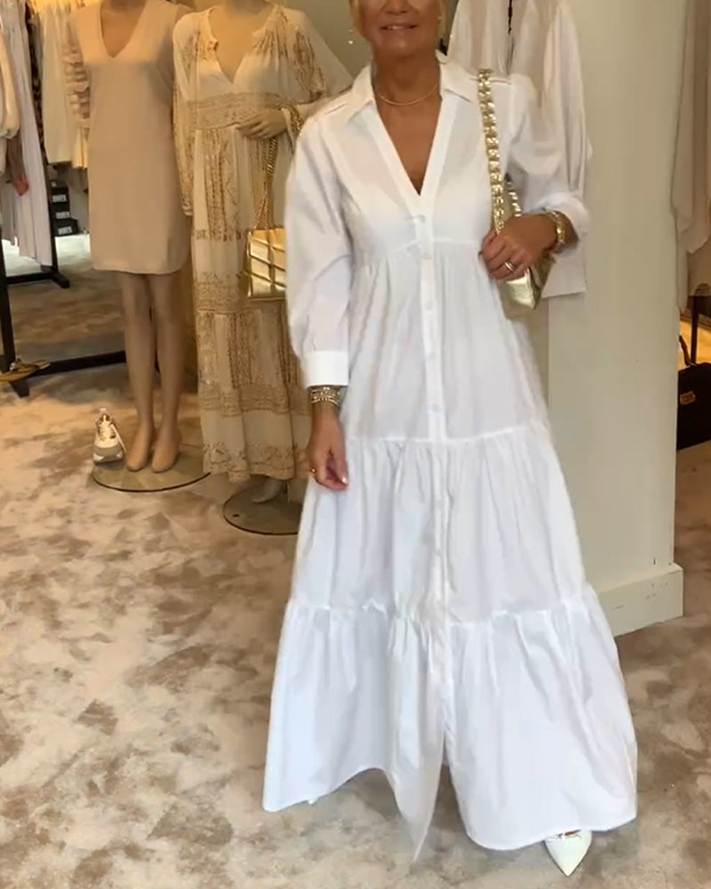 Klänning med knappar och slag