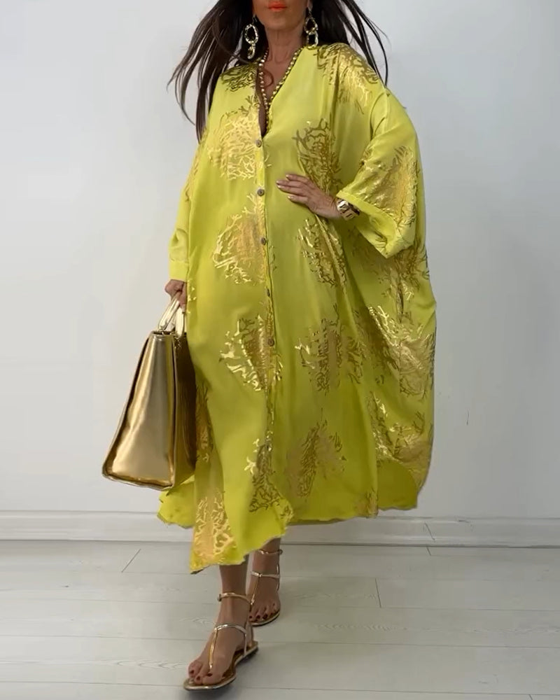 Långärmad lös klänning med tryck med knappar