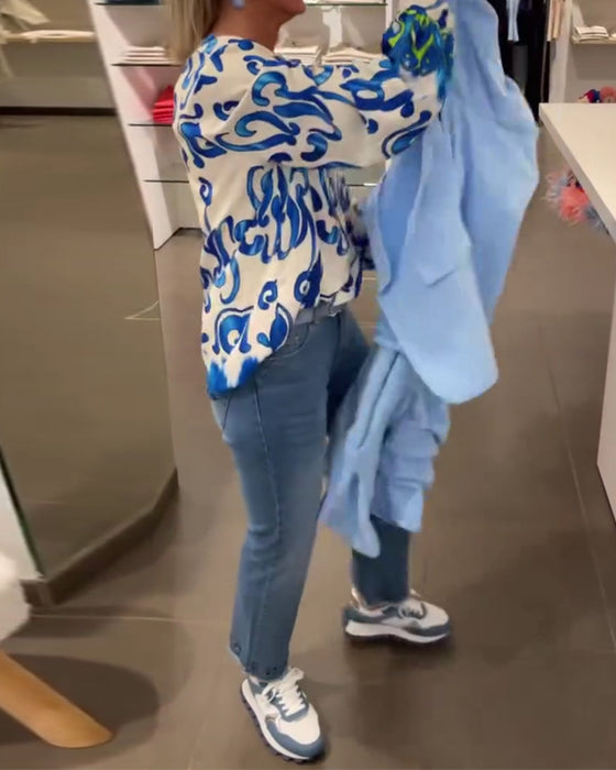 Elegant långärmad topp med tryckt V-ringning