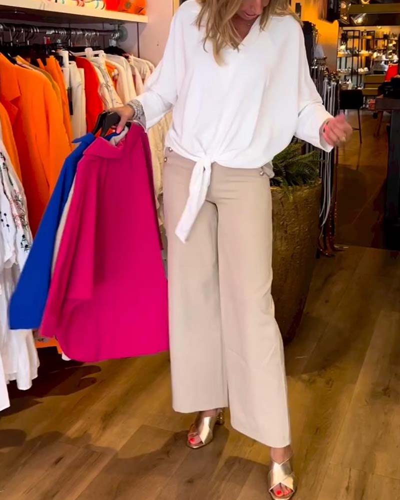 Knytblus i enfärgad V-ringning