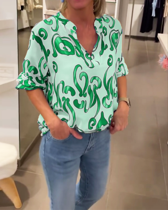 Elegant långärmad topp med tryckt V-ringning