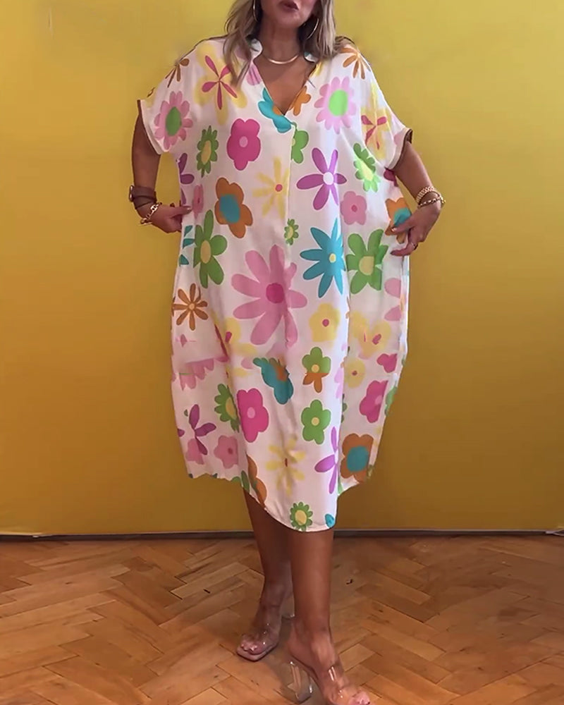 Lös V-ringad klänning med blommönster