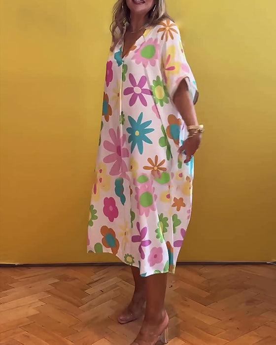 Lös V-ringad klänning med blommönster