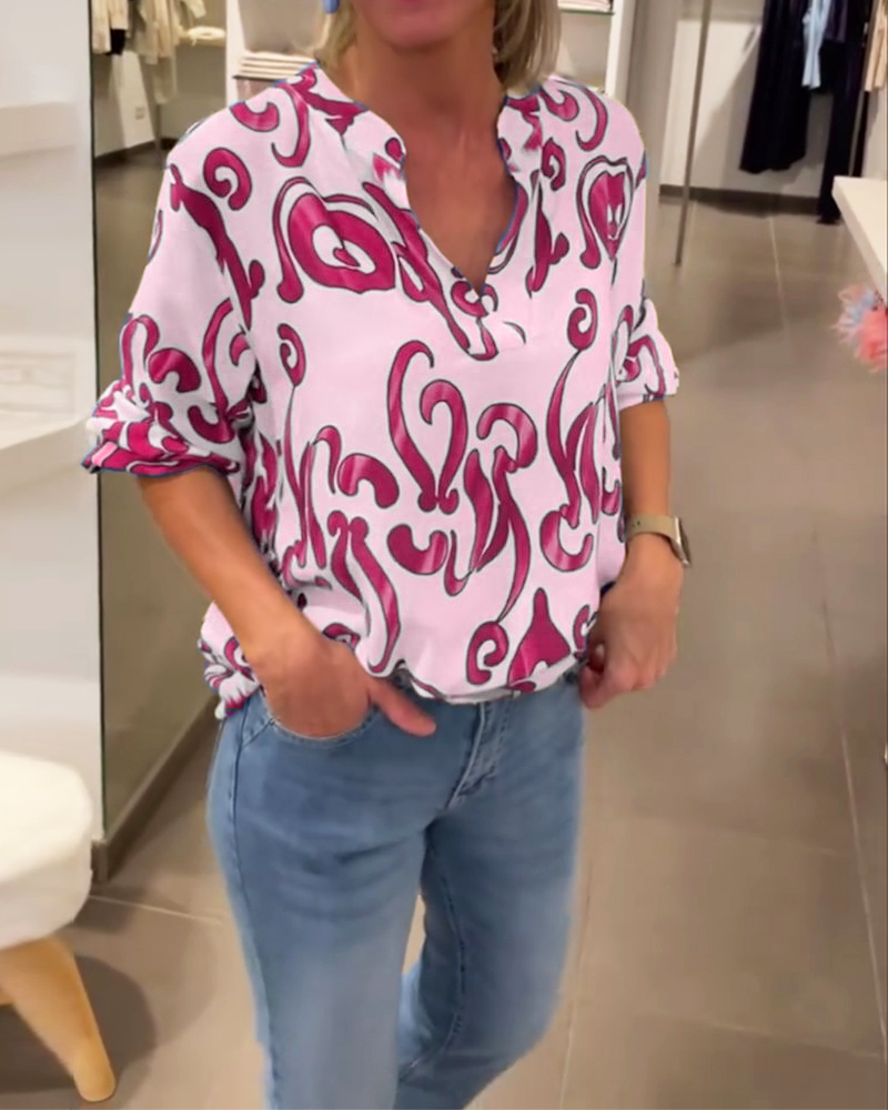 Elegant långärmad topp med tryckt V-ringning