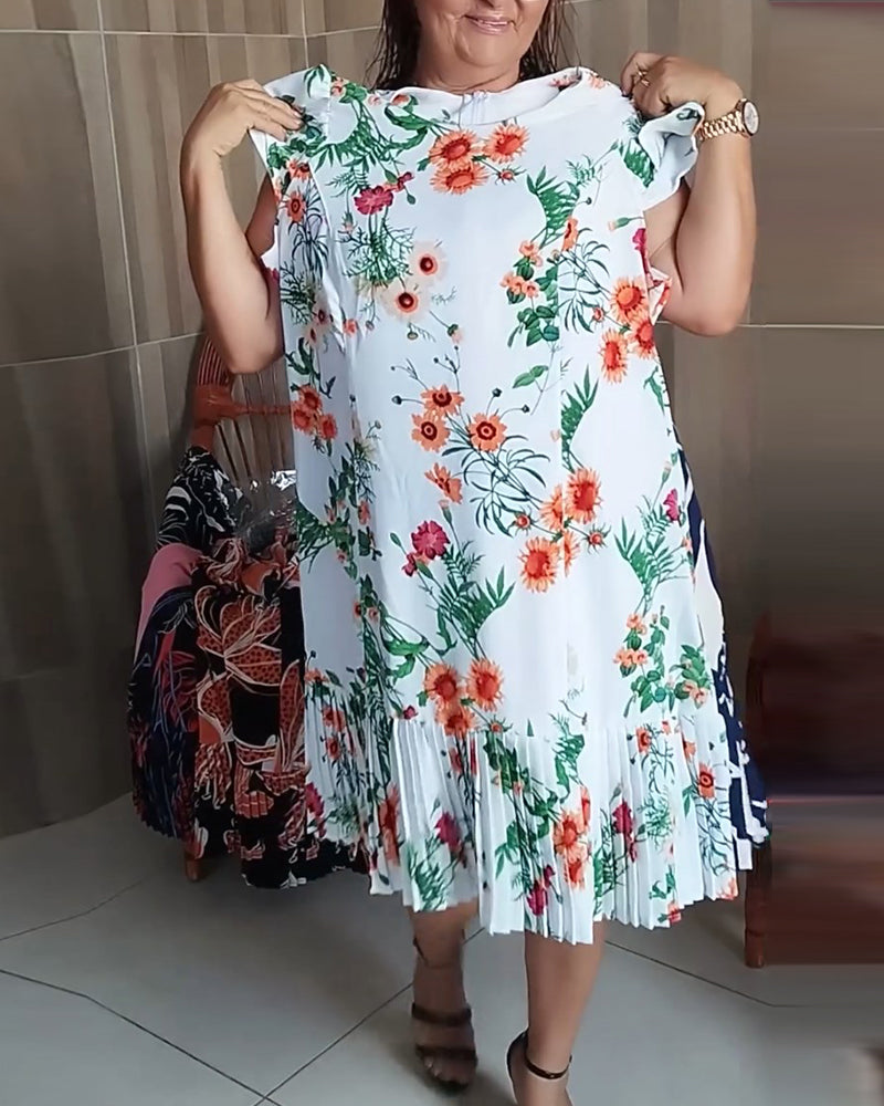 Plisserad klänning med blommönster