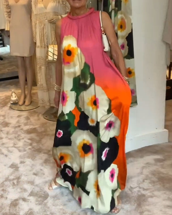 Ärmlös, blommig lång klänning
