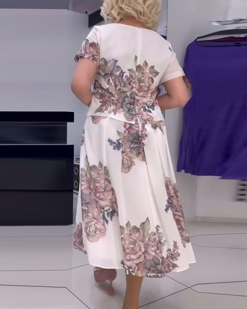 Blommig elegant klänning med rund hals