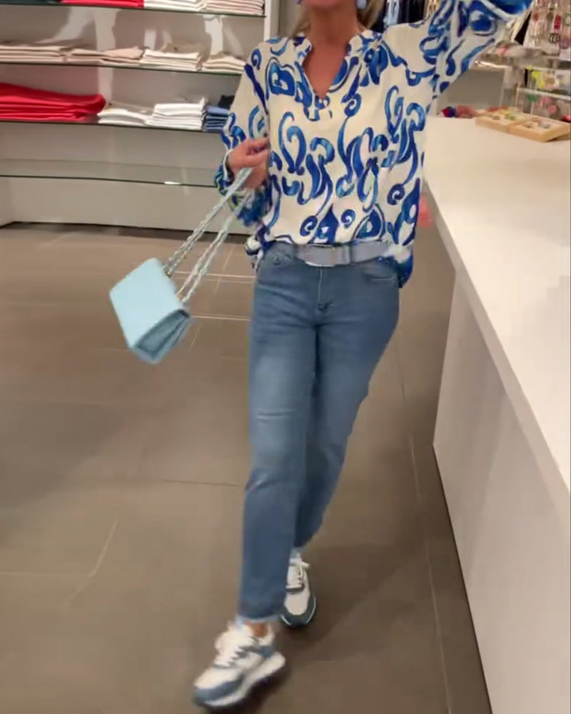 Elegant långärmad topp med tryckt V-ringning