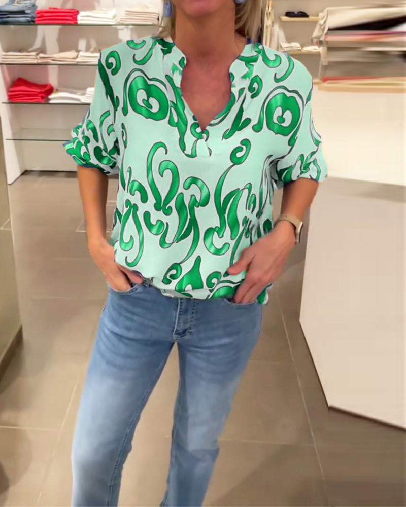 Elegant långärmad topp med tryckt V-ringning