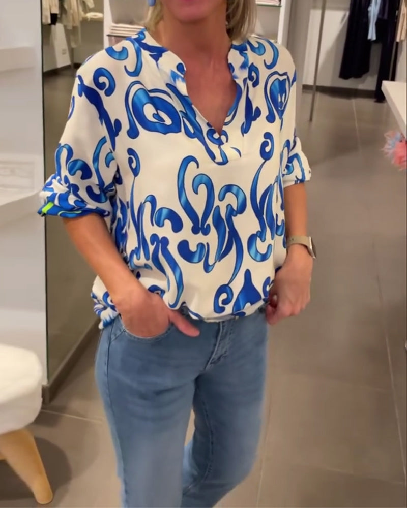 Elegant långärmad topp med tryckt V-ringning