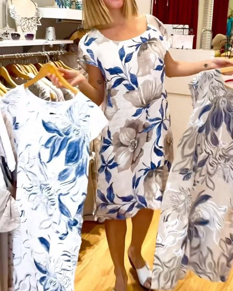 Elegant kortärmad klänning med blommönster