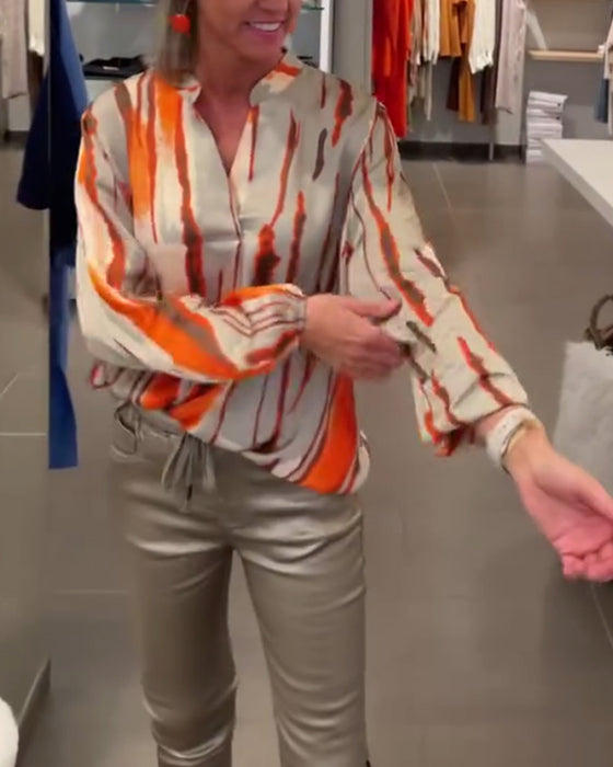 Långärmad blus med randigt tryck