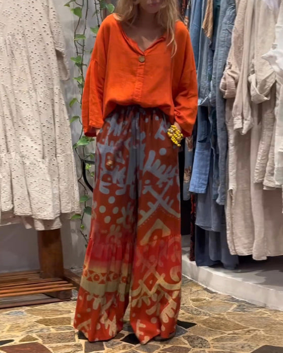 Lösa byxor med vida ben i fickor