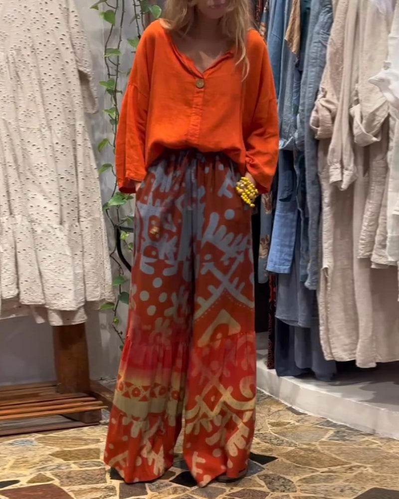 Lösa byxor med vida ben i fickor