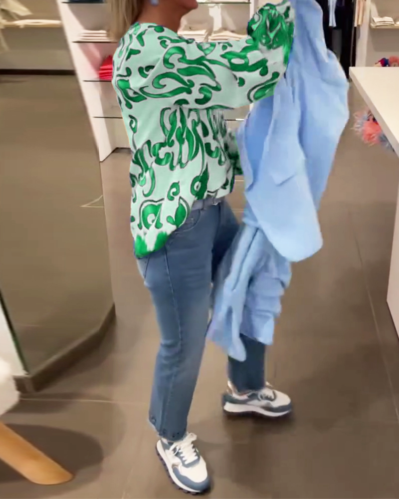 Elegant långärmad topp med tryckt V-ringning