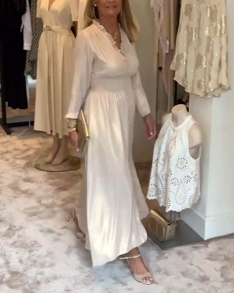 Lång klänning i spetskrage med knäppning i midjan