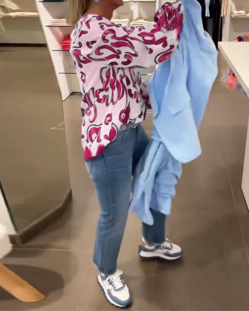 Elegant långärmad topp med tryckt V-ringning