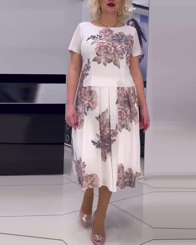 Blommig elegant klänning med rund hals