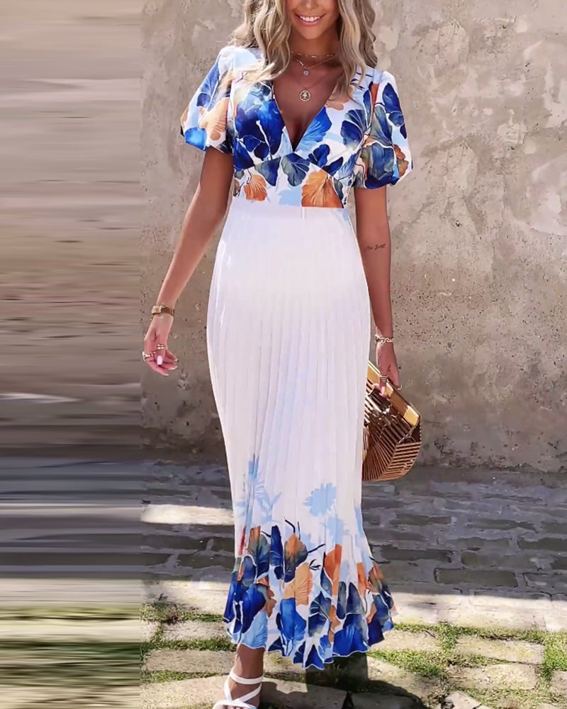 Klänning i djup V-modell med bubbliga ärmar