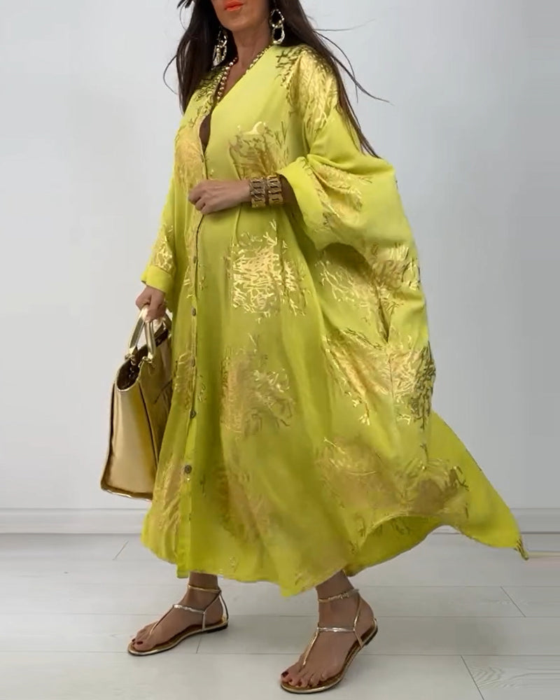 Långärmad lös klänning med tryck med knappar