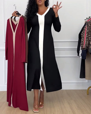 Elegant klänning med v-ringad slits i kontrastfärg