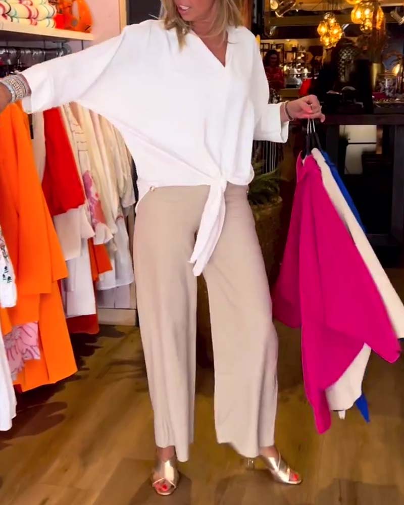 Knytblus i enfärgad V-ringning