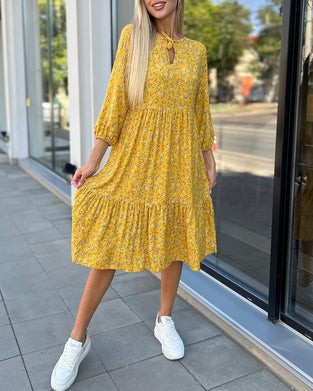 Fräsch blommig veckad vardagsklänning