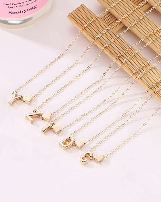 Enkelt persika hjärta bokstavshalsband