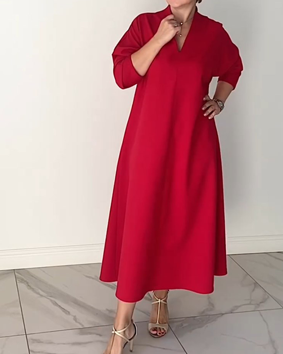 Enkel enfärgad v-ringad elegant klänning