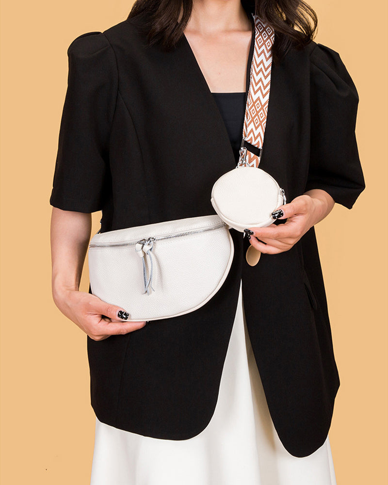 Kvinnors axelväska i sadelform, som också kan bäras som en crossbody-väska