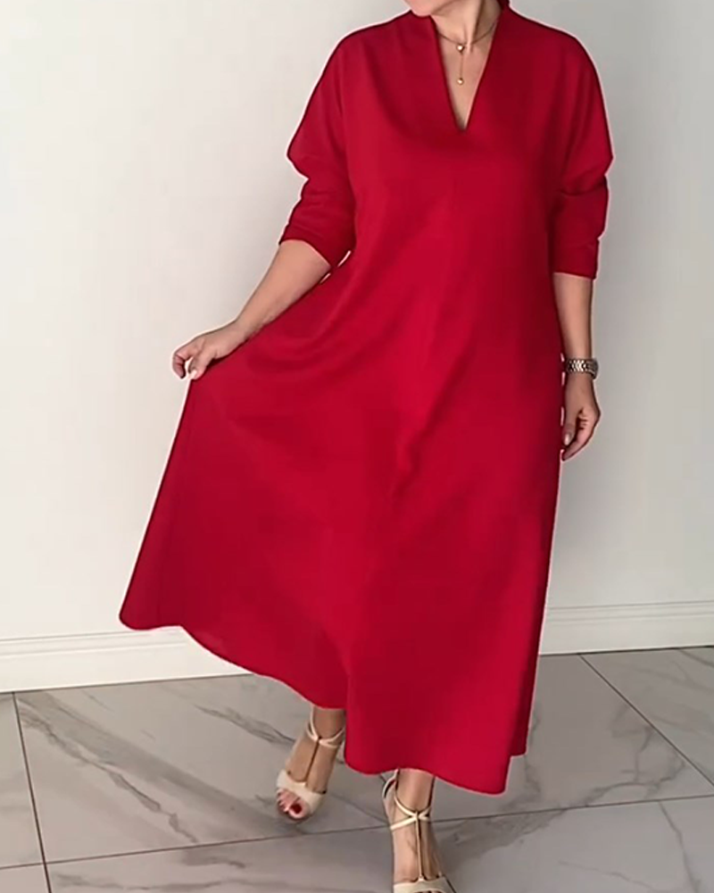 Enkel enfärgad v-ringad elegant klänning