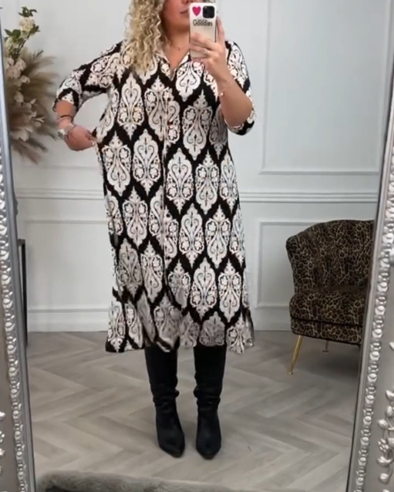 Lapelklänning med tryck i sidled