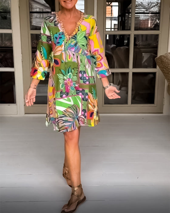 Fritidsklänning med blom- och grästryck