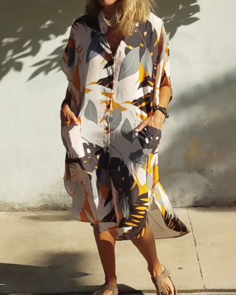 Klänning med fickor och lönnlövstryck