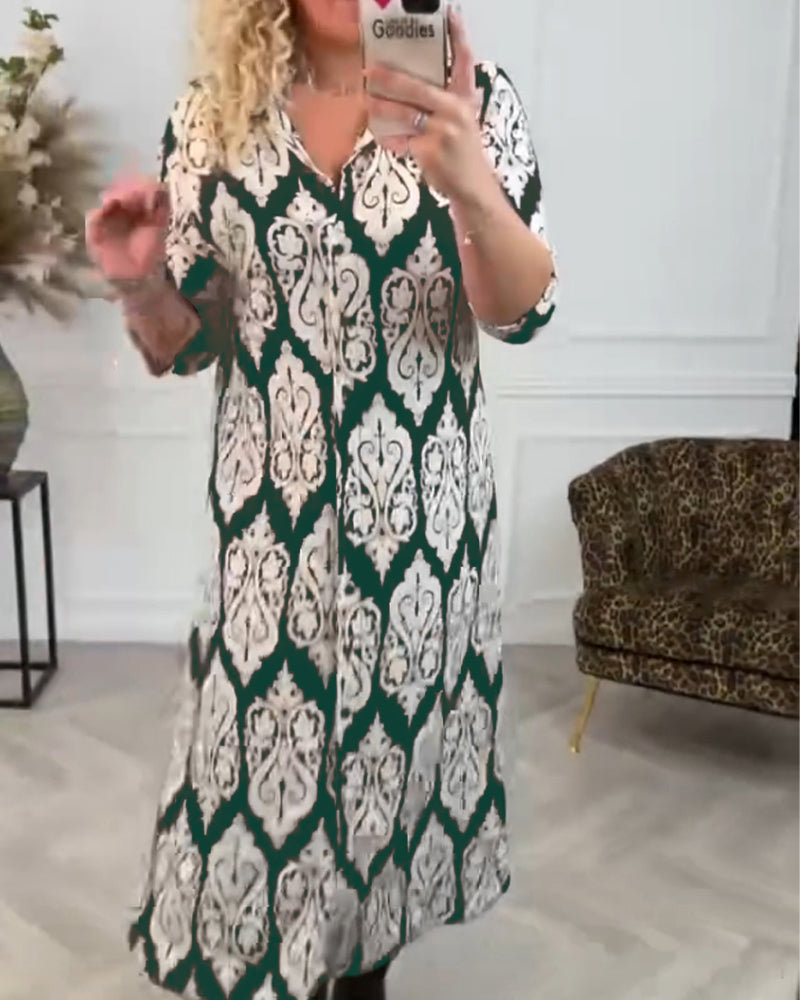 Lapelklänning med tryck i sidled