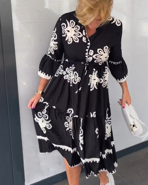 Blommig klänning med 3/4 ärm