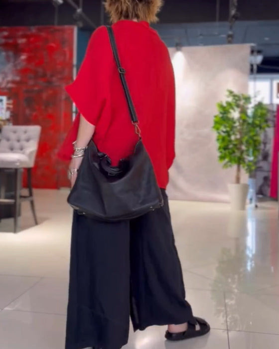 Enfärgad topp med hög halsringning