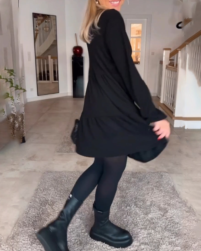 Enkel enfärgad långärmad klänning