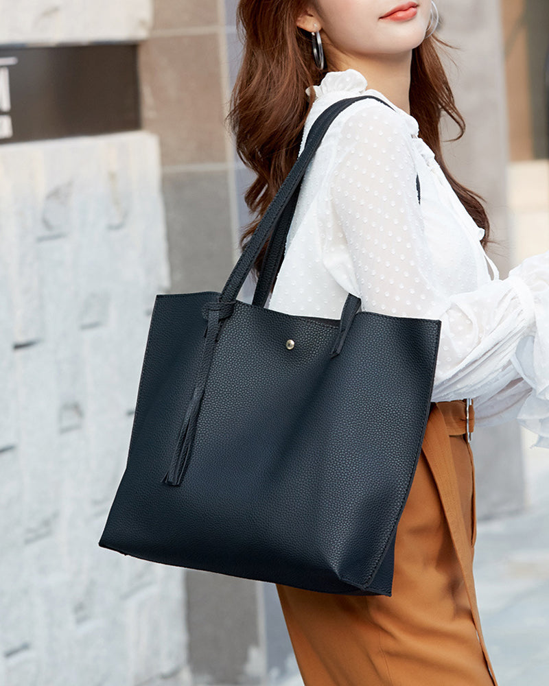 Kapacitet med enfärgad tofs axelväska med stor