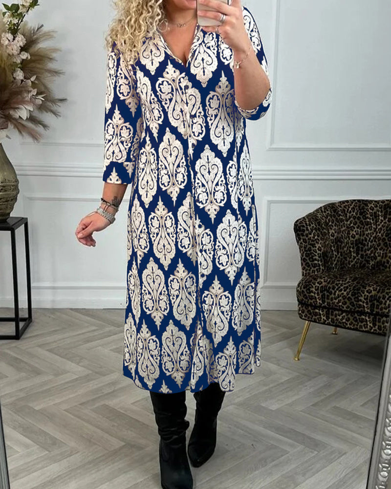 Lapelklänning med tryck i sidled