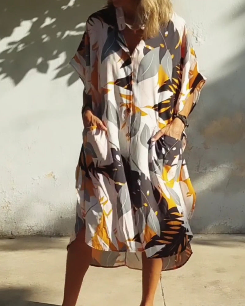 Klänning med fickor och lönnlövstryck