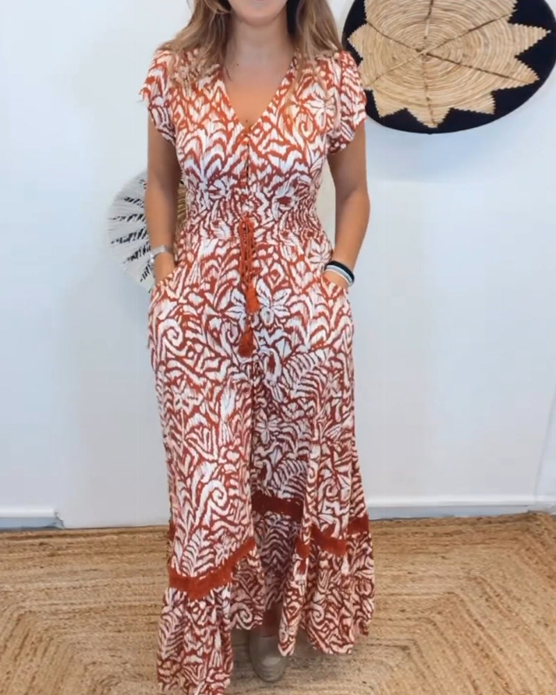 Kortärmad elegant klänning med V-ringad tryck