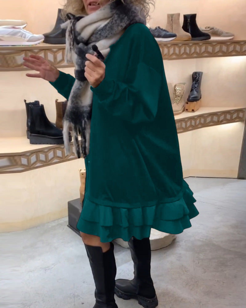 Klänning med elegant siluett och långa ärmar