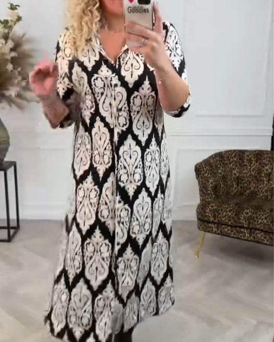 Lapelklänning med tryck i sidled