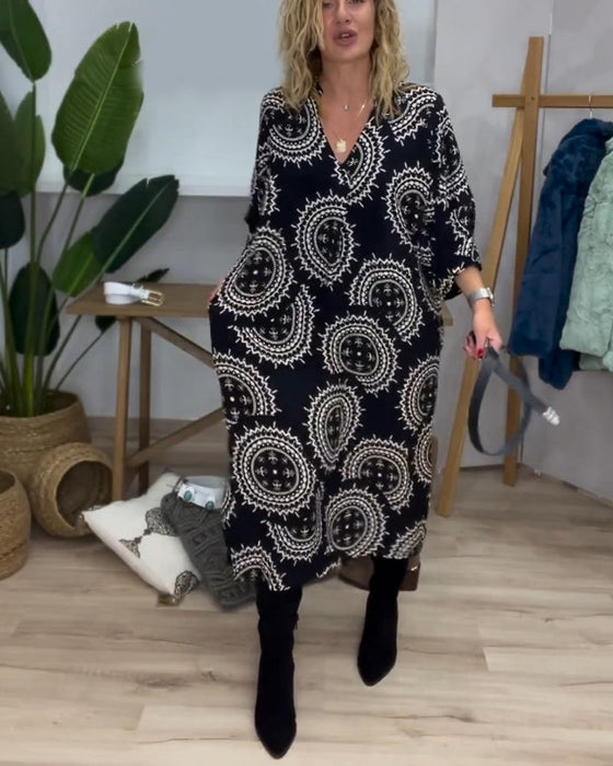 Klänning med V-ringning och långa ärmar