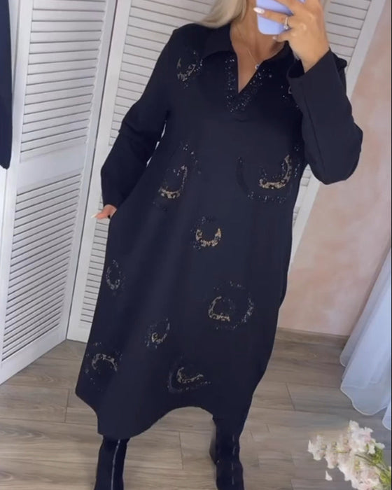 Långärmad midiklänning med slag