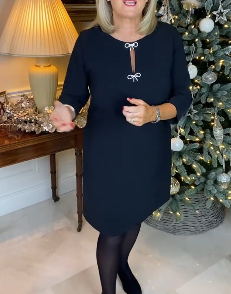 Enkel enfärgad klänning med rund hals